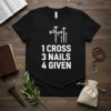 Black t-shirt with white text "1 CROSS 3 NAILS 4 GIVEN" and graphic of nails forming a cross