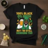 T-shirt with text "100% Black 0% Irish But I'm Still Drinking Tho" featuring a man in a green hat holding