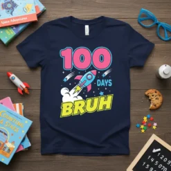 100 Days Bruh t-shirt with a pink 100, a blue rocket, and "DAYS BRUH" in yellow text