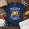 100 Days of School t-shirt with a cute cartoon school bus wearing a graduation cap and surrounded by books and
