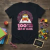 100 Days Of School t-shirt with a yellow school bus on an open book surrounded by numbers