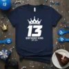 Navy t-shirt with white "13 Birthday King Est 2011" text and crown graphic, perfect for a 13th birthday celebration