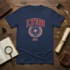 Navy blue t-shirt with "1738 EST." and a vintage compass graphic surrounded by a laurel wreath