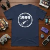 Navy blue t-shirt with white 1999 text and comet graphic in a circle, 1999 space design