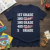 T-shirt with white text listing grades: 1st Grade Nailed It!, 2nd Grade Nailed It!, 3rd Grade, 4th Grade, 5th Grade