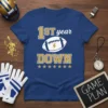 Blue t-shirt with "1ST year DOWN" text, football graphic, and stars, perfect for football players and fans