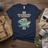 Navy t-shirt with "20 Life Is Beautiful At The Beach Camping 23" text and a retro wave and sun graphic