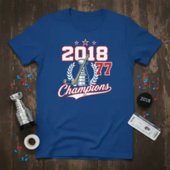 Blue t-shirt featuring "2018 77 Champions" text with a hockey trophy graphic and laurel wreath