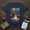 Navy blue t-shirt featuring "2020 So Profoundly Stupid" text and a beagle dog writing in crayon about history