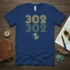 Navy blue t-shirt with "302 302" text in yellow and green retro stripes, featuring a small globe graphic