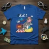 321 Countdown Race T-Shirt design with a pig, rabbit, and cat on a road with a 2025 TV screen