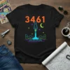 Black t-shirt with the number 3461, a rocket launching, stars, moon, and landscape in neon colors