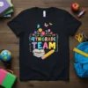 4th Grade Team text design with colorful flowers, butterflies, books, and a pencil on a black t-shirt