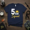 Navy blue t-shirt with "5 AM Squad" text and a rising sun graphic, representing early morning fitness and dedication