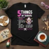 Graphic t-shirt design featuring "5 Things You Should Know About My Grandma" in bold pink and white text, with numbered
