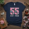 Navy t-shirt with "55 EST. 1968" in large numbers filled with pink and blue flowers, celebrating a 55th birthday