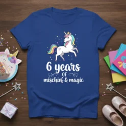 Blue t-shirt with a white unicorn wearing a crown and the text "6 years of mischief & magic" for a