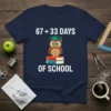 Navy t-shirt displaying '67 + 33 Days Of School' with a graduation owl on books