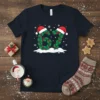 Black t-shirt featuring the number 67 designed with green holly leaves, red berries, and Santa hats, surrounded by snowflakes