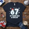67 Years Old & Chillin' t-shirt design with snowman and snowflakes, perfect for a 67th birthday celebration