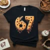 The number 67 designed to look like a chocolate chip cookie dripping with chocolate, on a black t-shirt