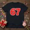 Red "67" graphic with fireworks and heart pattern on a dark t-shirt, perfect for a 67th birthday celebration gift