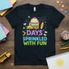 7 Days Sprinkled With Fun quote on a black t-shirt with a cartoon school bus cupcake and a pencil character