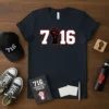 Navy t-shirt with bold white and red "716" design featuring a black raised fist graphic