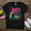 Black t-shirt with "80's Girl" text, rainbow, and retro boombox graphic in neon colors
