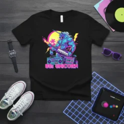 80s Unicorn graphic tee featuring a muscular unicorn playing a keyboard with retro boomboxes and neon accents