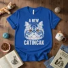 A New Catincak t-shirt design with a detailed illustration of a Persian cat's face and the text "A NEW CATINCAK"