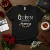 A Queen Are Born In January text with crown graphic on black t-shirt