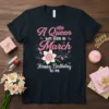 Black t-shirt with pink glitter text "A Queen Was Born In March Happy Birthday To Me" and a floral daffodil