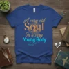 A very old Soul In a very Young Body quote on a blue t-shirt with a tree graphic and a
