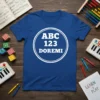Blue t-shirt with white text "ABC 123 DOREMI" inside a circle, designed for kids learning