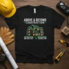Black t-shirt with "Above & Beyond Construction" logo, house graphic, phone number, and website