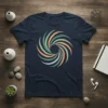 Abstract swirl graphic t-shirt in navy blue featuring green, orange, and purple curved lines forming a vortex