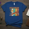 Abyssinian cat t-shirt design with Egyptian hieroglyphs and pyramids, featuring a leaping brown cat