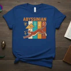 Abyssinian cat t-shirt design with Egyptian hieroglyphs and pyramids, featuring a leaping brown cat