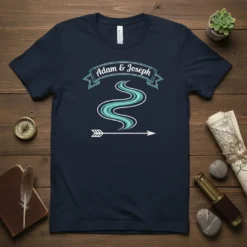 Adam & Joseph matching couple t-shirt with a flowing river graphic and arrow, representing their journey together
