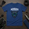 Adidas Performance t-shirt featuring a geometric black panther head with green eyes and white text "ADIDAS PERFORMANCE" above it