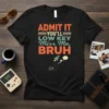 Black t-shirt with "ADMIT IT YOU'LL LOW KEY Miss Me, BRUH" text and a small rocket graphic