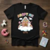 Adopt Me Cute Unicorn Gingerbread House T-Shirt with a rainbow and clouds, featuring a unicorn holding a cookie