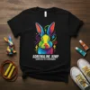 Black t-shirt with vibrant, colorful rabbit graphic and text "ADRENALINE JUMP BOUNCE INTO THE EXTRAORDINAY"