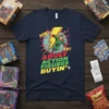 Adult Action Figures Buyin' t-shirt with retro comic-style POW! ZAF! text and a superhero graphic