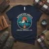 Adventure Awaits Explore Discover Live t-shirt with mountain sunset and campfire graphic