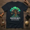 Adventure Awaits Explore The World Build Your Dreams quote on a navy t-shirt featuring a magical treehouse with rockets