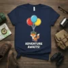 Adventure Awaits! text with a cute fox holding balloons on a navy t-shirt, perfect for travel lovers