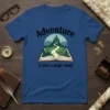 Adventure is just a page away quote on a blue t-shirt with an open book graphic and a fantasy landscape