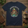 Adventures Await In The Fungal Forest t-shirt with a frog explorer on a mushroom castle, surrounded by magical mushrooms